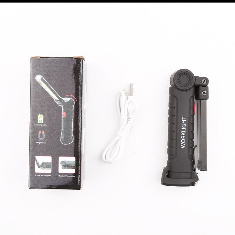 "Compact LED work light in use outdoors — camping hunting night fishing flashlight"
