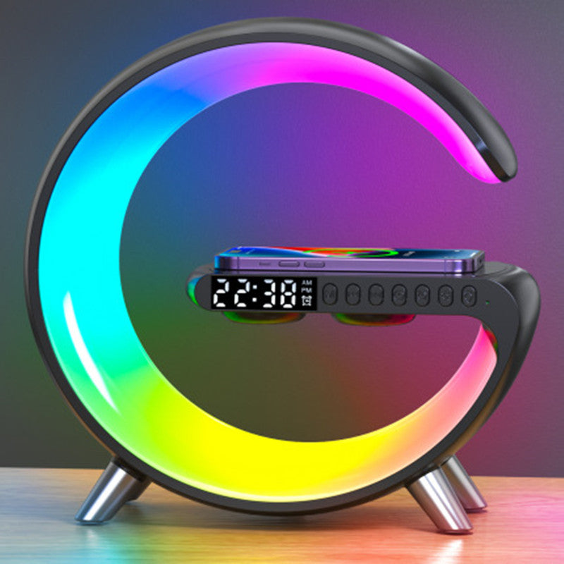 "G-Shape LED lamp in black — front view with wireless charger"
