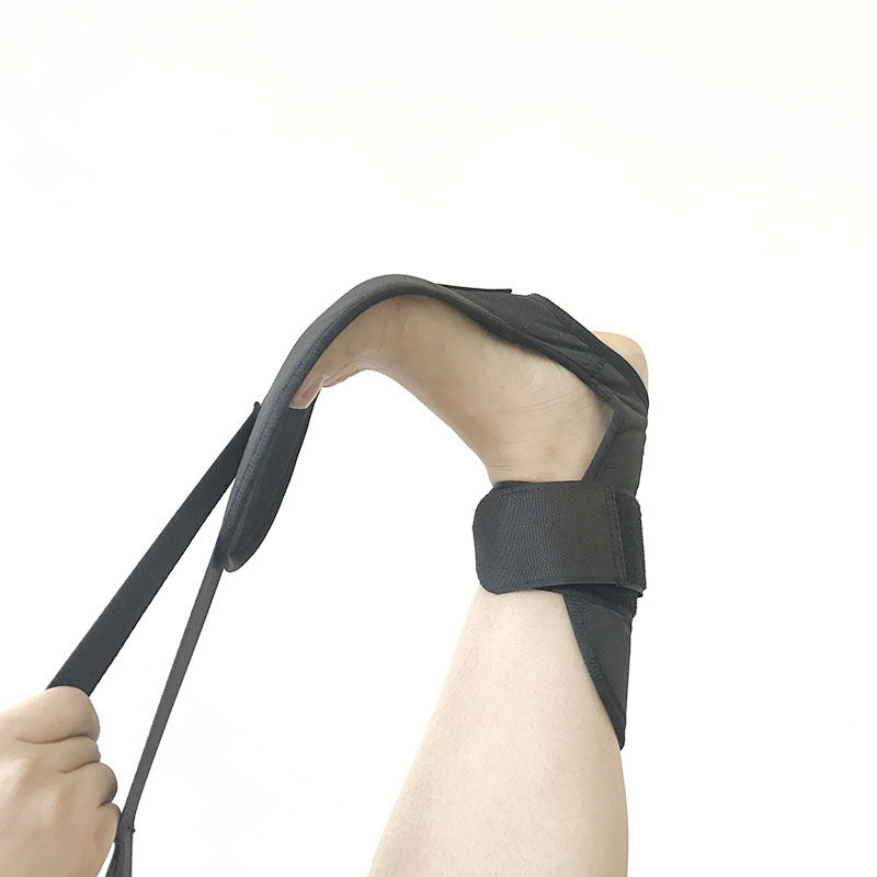 "Foot and ankle strap used for physical therapy — post-injury recovery stretching"
