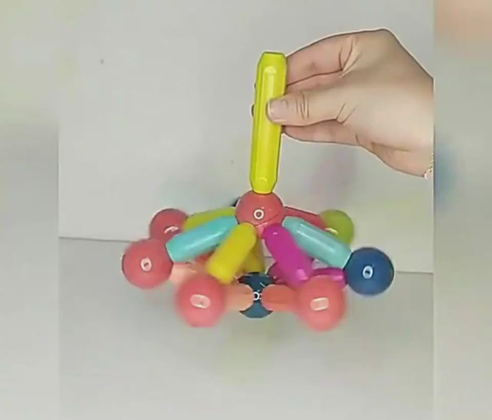 Kids magnetic stick blocks toy — 3D structure example— child building 
